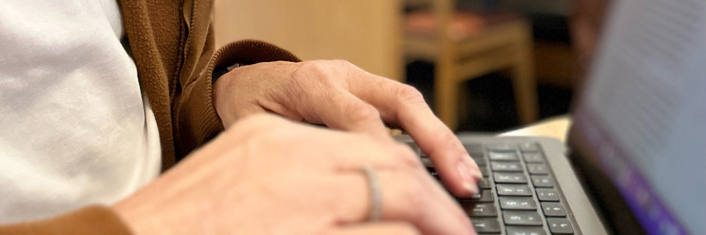 Feature image: Hands typing on a laptop keyboard