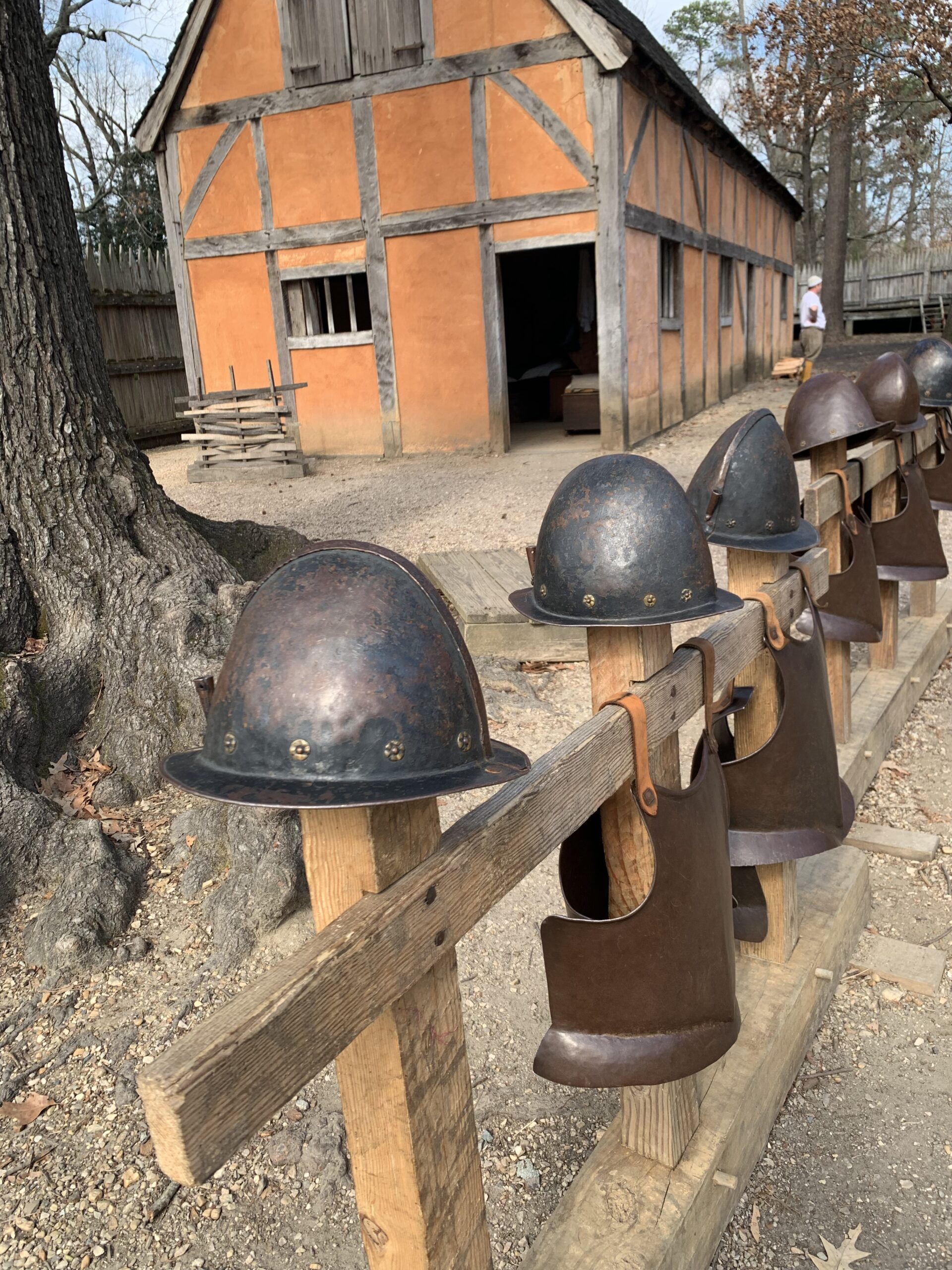 Colonial armor displayed on a fence in Jamestown